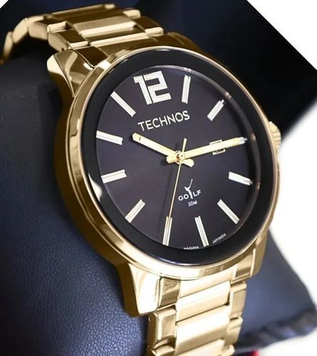 relogio technos dourado